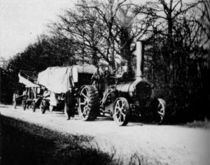 Fig.6 Threshing train on the road